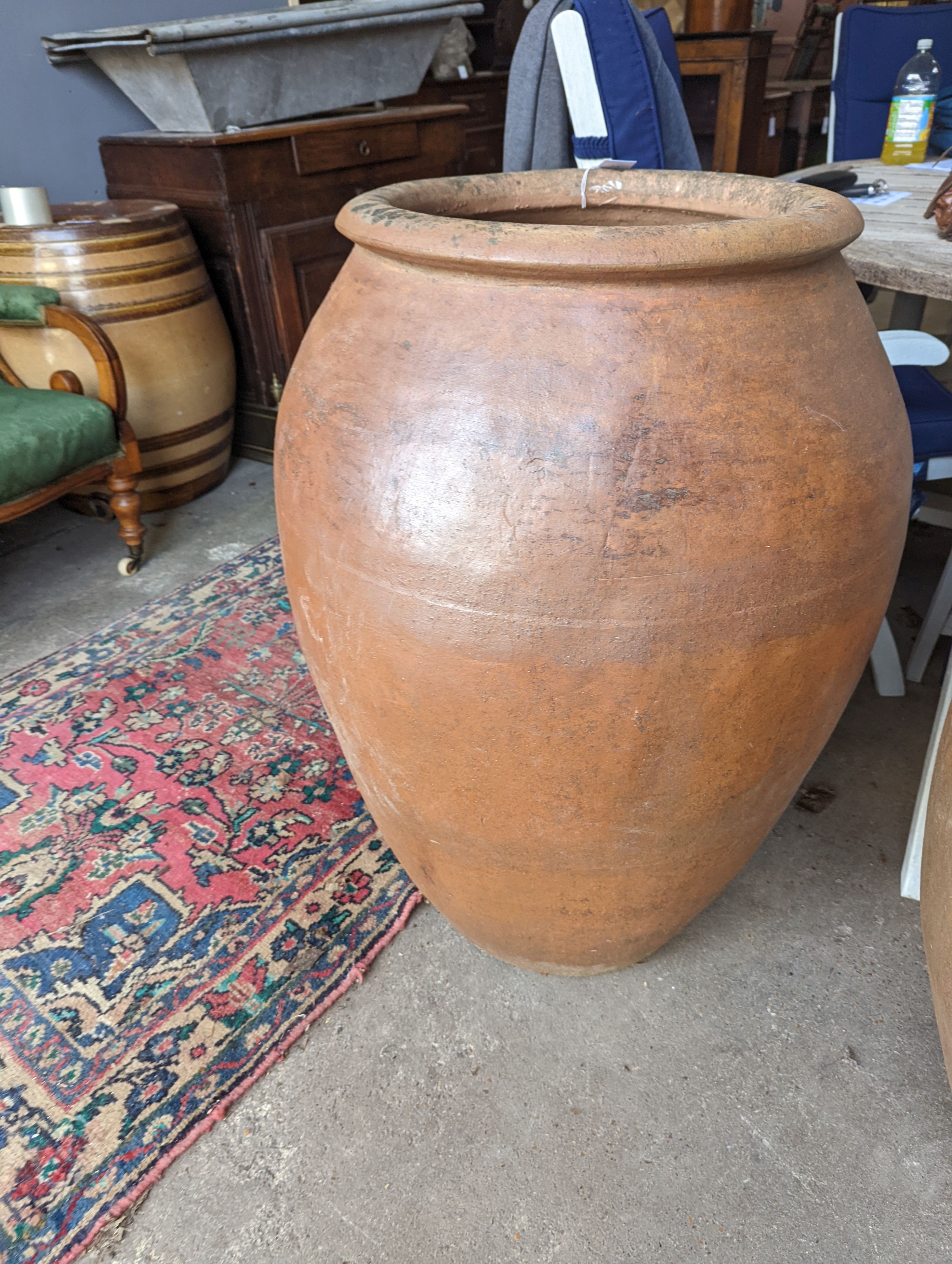 A pair of large terracotta garden planters, height 88cm